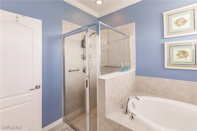 bathroom featuring separate shower and tub and ornamental molding