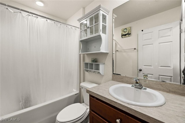 full bathroom featuring shower / tub combo, vanity, and toilet