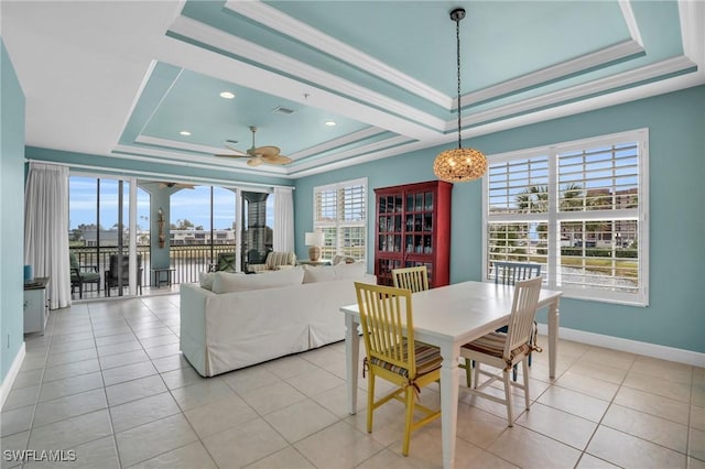 7532 Lake Valencia Ct Unit 5B, Fort Myers Beach, FL 33931 - dining area with a tray ceiling, baseboards, and a healthy amount of sunlight