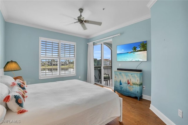 7532 Lake Valencia Ct Unit 5B, Fort Myers Beach, FL 33931 - bedroom featuring ornamental molding, baseboards, access to outside, and wood finished floors