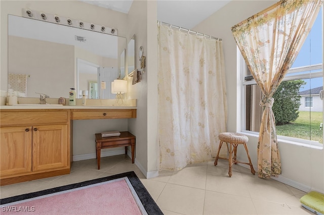 bathroom featuring tile patterned floors, vanity, and a shower with shower curtain