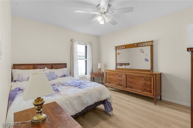 bedroom with ceiling fan and light hardwood / wood-style floors