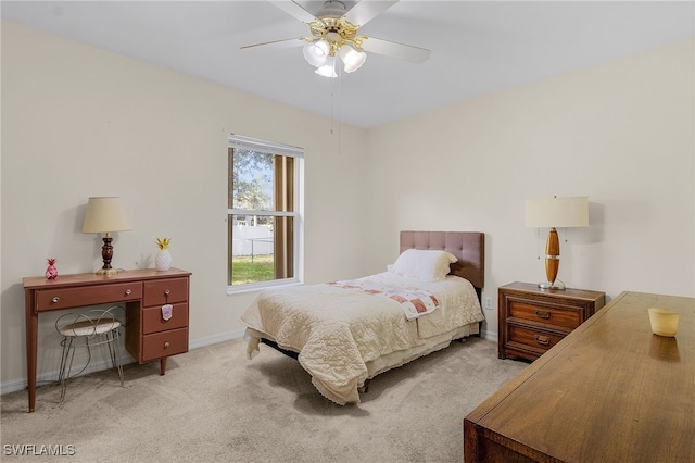 bedroom featuring ceiling fan and light colored carpet