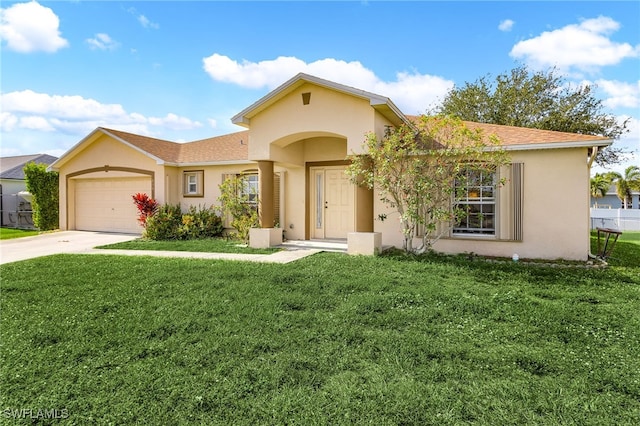 view of front of home with a garage and a front lawn