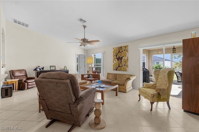 tiled living room featuring ceiling fan and a healthy amount of sunlight