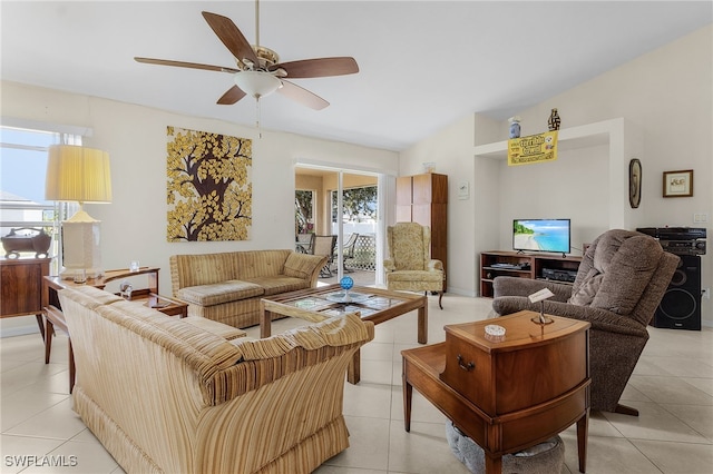 tiled living room with plenty of natural light and ceiling fan