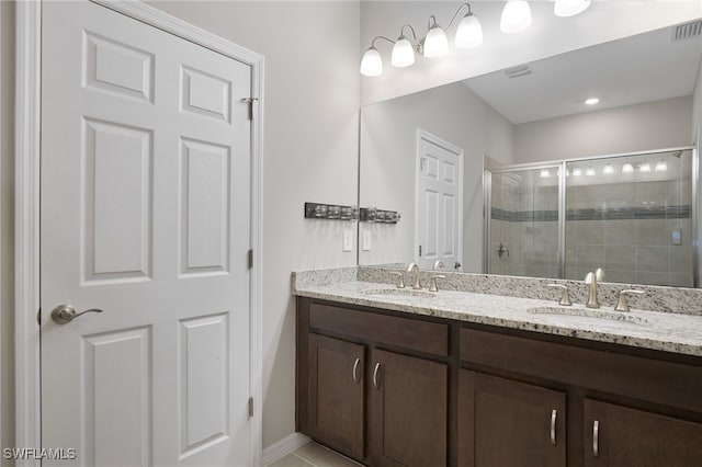 bathroom featuring vanity, tile patterned floors, and an enclosed shower