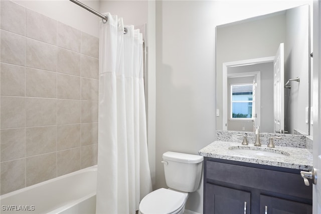 full bathroom featuring vanity, toilet, and shower / tub combo with curtain