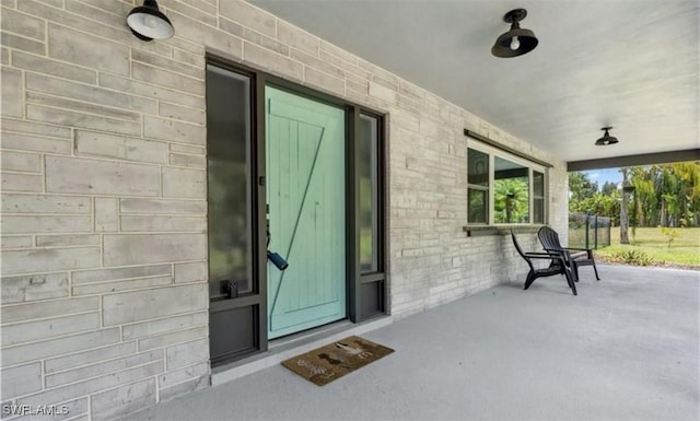 doorway to property featuring a porch