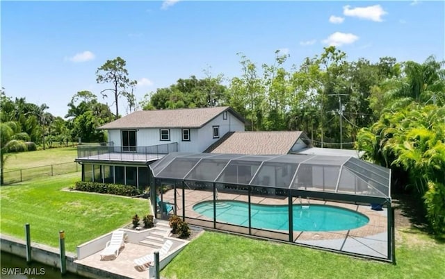 exterior space featuring a yard, a patio, and a lanai