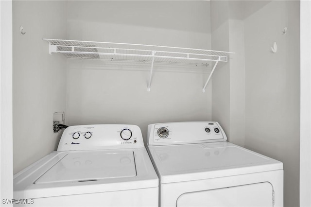 clothes washing area with independent washer and dryer