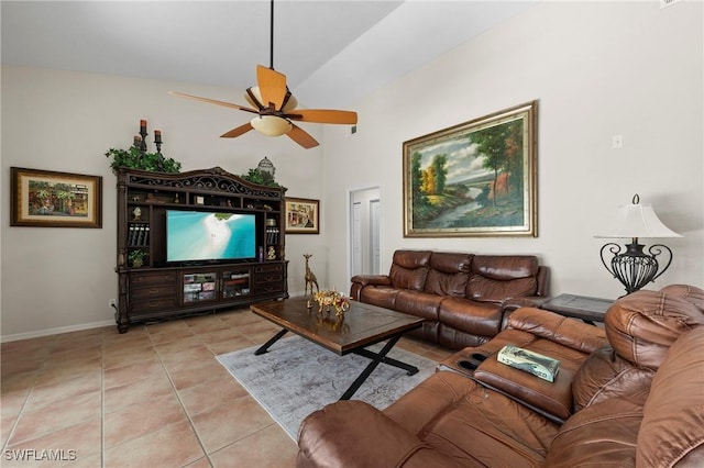 tiled living room featuring ceiling fan and lofted ceiling