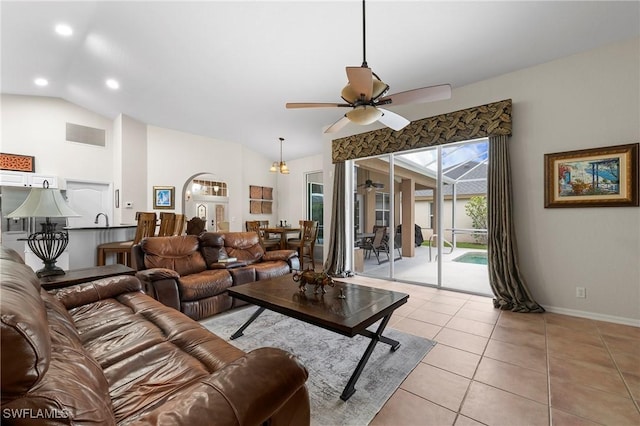 tiled living room featuring vaulted ceiling and ceiling fan