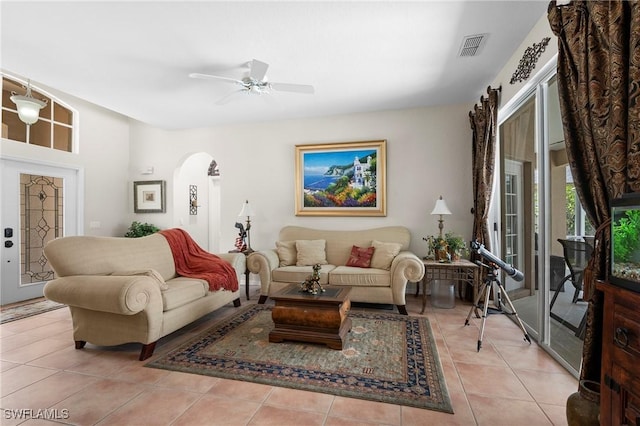 living room featuring ceiling fan and light tile patterned floors