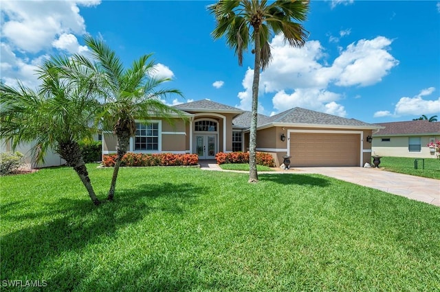 view of front of property with a front yard and a garage