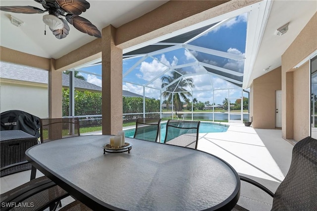 view of pool with a patio, ceiling fan, a lanai, and a grill