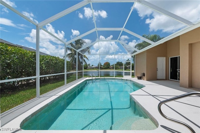 view of swimming pool with a water view, glass enclosure, and a patio area