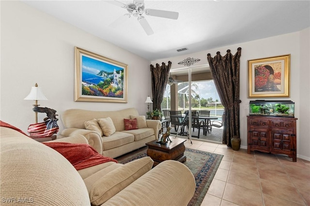 tiled living room featuring ceiling fan