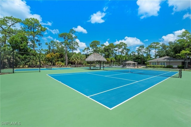 view of tennis court with basketball court