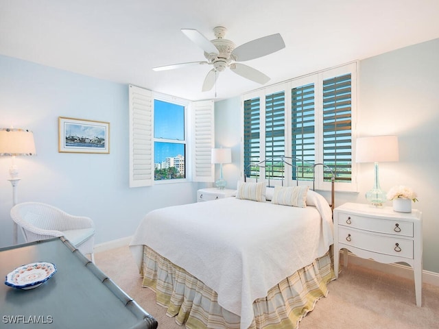 bedroom featuring ceiling fan and light colored carpet