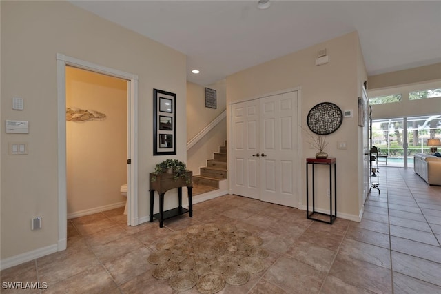 foyer featuring light tile patterned floors