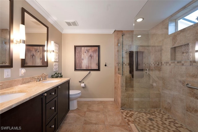 bathroom with crown molding, vanity, toilet, and an enclosed shower