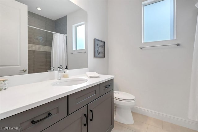 bathroom featuring toilet, vanity, tile patterned floors, and curtained shower