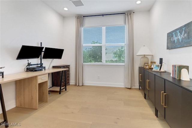 office space with light hardwood / wood-style flooring