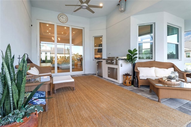 sunroom / solarium with ceiling fan