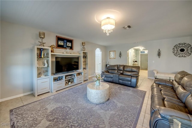 living room with light tile patterned flooring