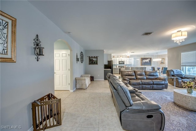 living room with light tile patterned flooring