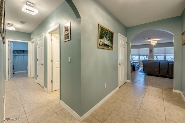 hall with light tile patterned flooring