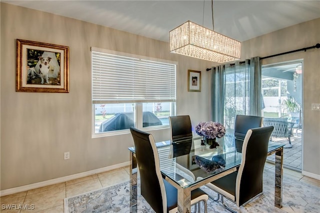 tiled dining area with a notable chandelier