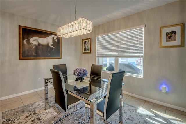 dining room with light tile patterned floors and a notable chandelier