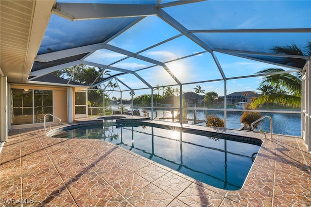 view of swimming pool with a water view, an in ground hot tub, a lanai, and a patio