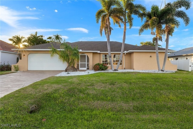 single story home with a garage and a front yard