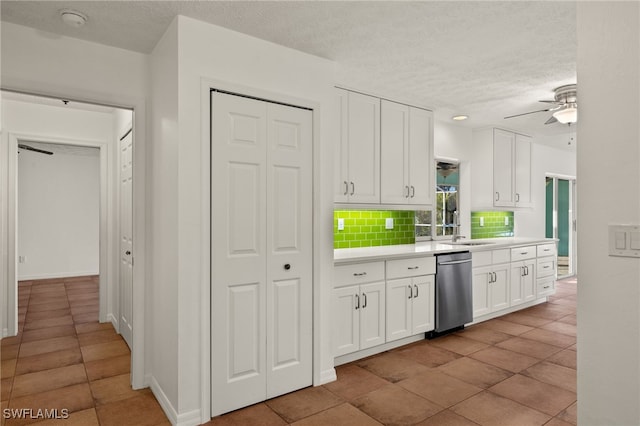 kitchen with ceiling fan, dishwasher, white cabinets, a textured ceiling, and decorative backsplash