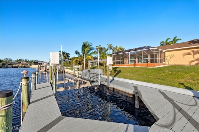 dock area with a water view, glass enclosure, and a lawn