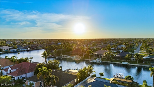 aerial view at dusk with a water view