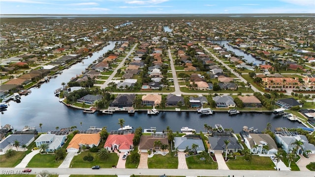 aerial view with a residential view and a water view