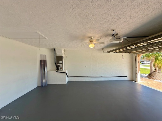 garage featuring heating unit and a garage door opener