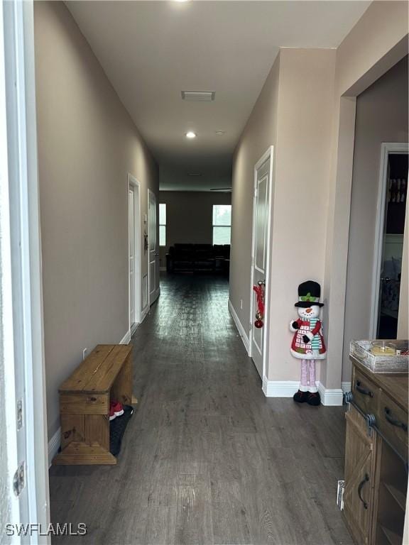 corridor featuring dark hardwood / wood-style floors