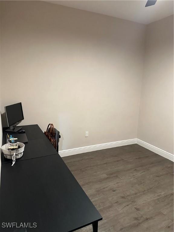 office area featuring ceiling fan and dark hardwood / wood-style flooring