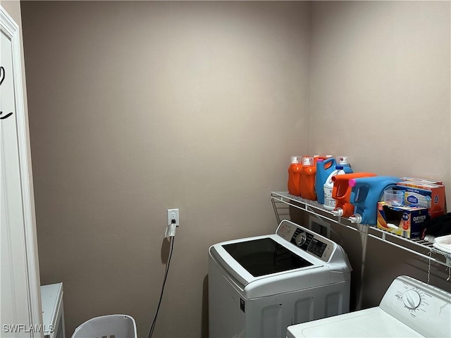 laundry room featuring washing machine and dryer