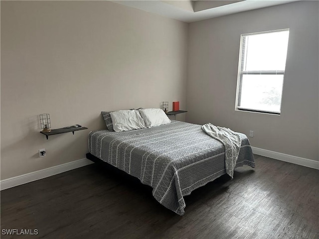 bedroom featuring dark hardwood / wood-style floors