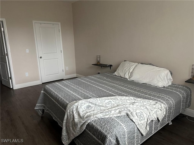 bedroom featuring dark hardwood / wood-style floors