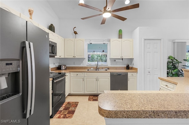 kitchen featuring sink, ceiling fan, light tile patterned floors, white cabinetry, and stainless steel appliances