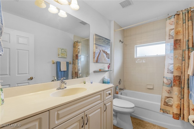 full bathroom with toilet, tile patterned floors, vanity, and shower / tub combo with curtain