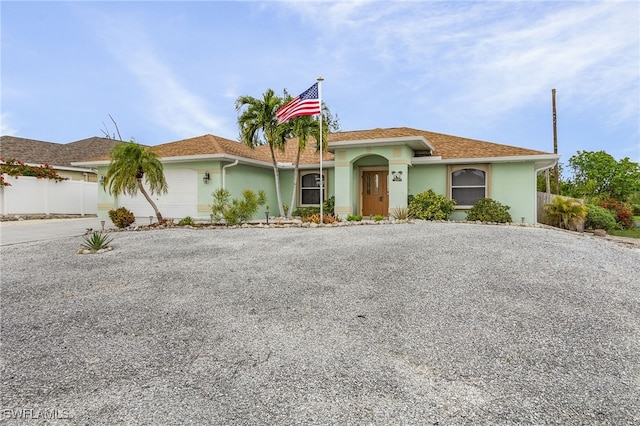 view of front of property with a garage