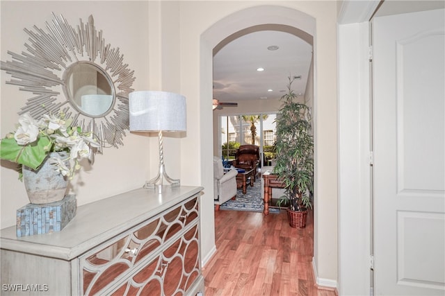 corridor with hardwood / wood-style floors